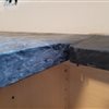 The picture shows how CanadianSoapStone.com installed our kitchen counter. 1/4 inch lip hanging below the rest of the counter so we could not install our undermount sink. Would you